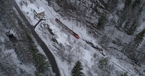 TMR train leaving les Marécottes, form above - Aerial 4K Stock Footage 104597621