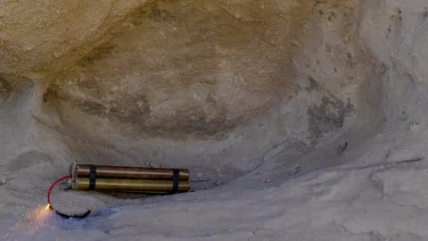 TNT / DYNAMITE ABOUT TO EXPLODE ROCK FORMATION.  FULL HD. Stock Footage 167035613