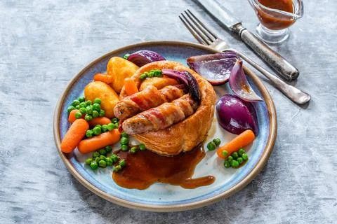 Toad in the hole Stock Photos