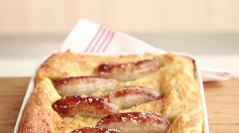 Toad in the hole (sausages in batter, England) Stock Footage 24671833