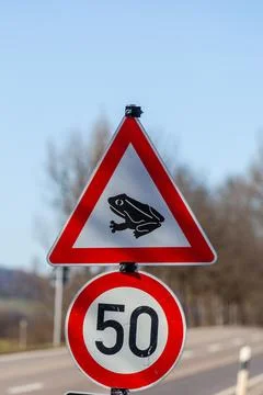 Toad migration warning sign on german street Stock Photos