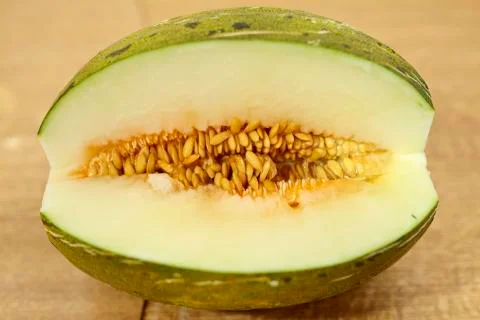 Toad skin melon halved Stock Photos