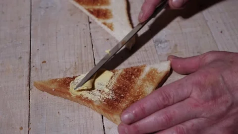 Toast and butter on a table medium Video stock 167234842