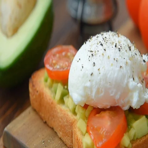 Toast with avocado and egg cooked in olive oil Stock Footage 69598878