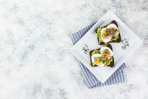 Toast with avocado and egg Stock Photos