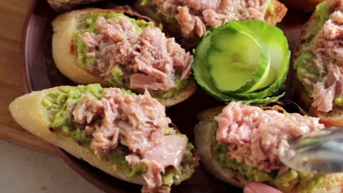 Toast with avocado and tuna. Stock Footage 172108873