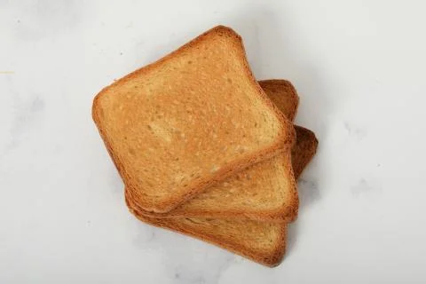 Toast biscuits over white background crunchy food Stock Photos