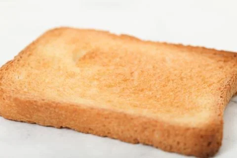 Toast biscuits over white background crunchy food Stock Photos