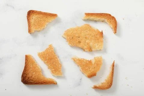 Toast biscuits over white background crunchy food Stock Photos