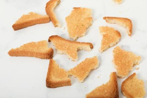 Toast biscuits over white background crunchy food Stock Photos