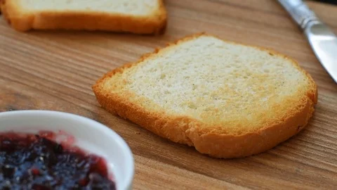 Toast with blackberry and blueberry jam Stock Footage