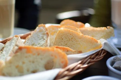 Toast bread in the basket on the table in caffe. Breakfast concept Stock Photos