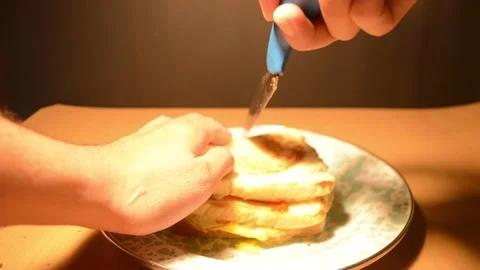 A toast bread with egg cut into two pieces shows egg inside Video stock 275569260