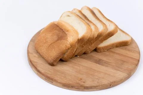 Toast bread isolated over white on the cutting board Stock Photos