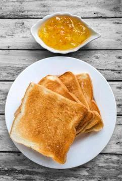 Toast bread with orange jam Stock Photos