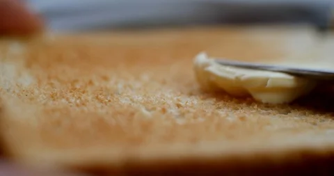 Toast buttering closeup 4K Stock Footage 87252390