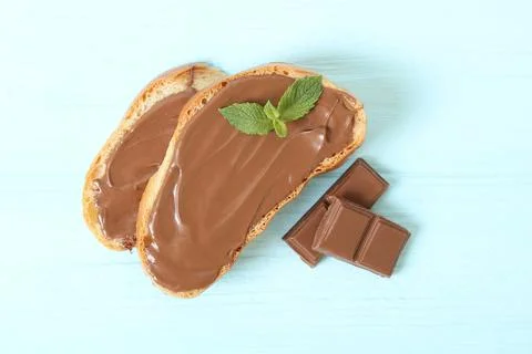 Toast with chocolate paste on the table. Stock Photos