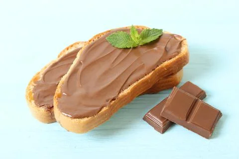 Toast with chocolate paste on the table. Stock Photos