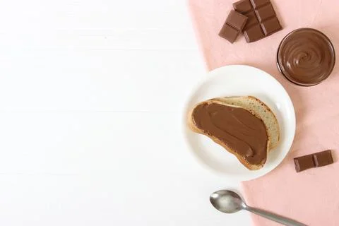 Toast with chocolate paste on the table. Stock Photos
