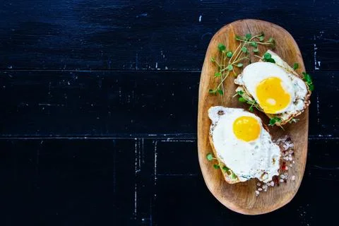 Toast with fried eggs Stock Photos