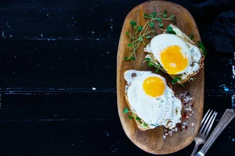Toast with fried eggs Stock Photos