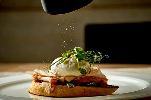 Toast with ham and poached egg in a plate. Selective focus, close-up Stock-Fotos