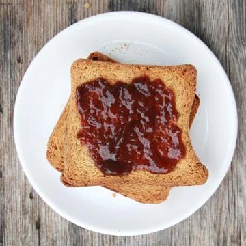 Toast with jam Stock Photos