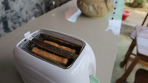 Toast pops up out of toaster Stock Footage 62780265