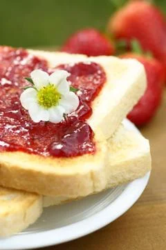 Toast with strawberry jam Foto stock