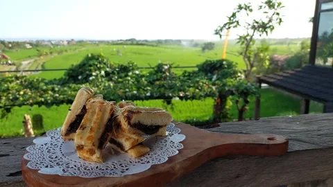Toast on the table with scenic background Stock Footage 162606542