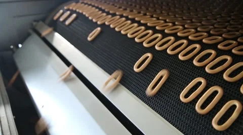 Toasted bagels on the conveyor Stock Footage 59824978