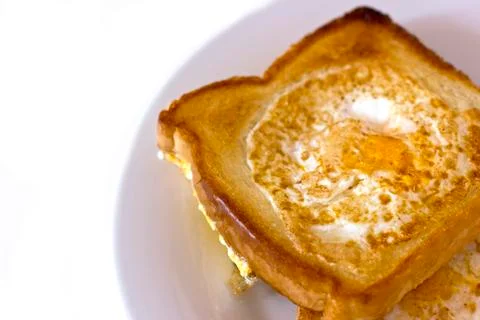 Toasted bread fried with egg inside. Isolated Stock Photos