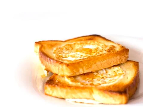 Toasted bread fried with egg inside. Isolated Stock Photos