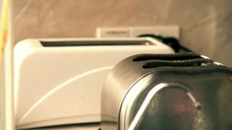 Toasted bread jumps out of the toaster - close up, slow motion shot at 240fps Stock-Footage 21442107