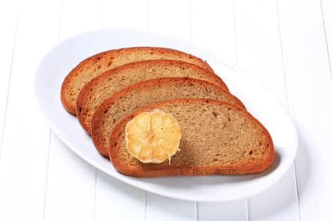Toasted bread with lemon slice on plate Fotos Stock