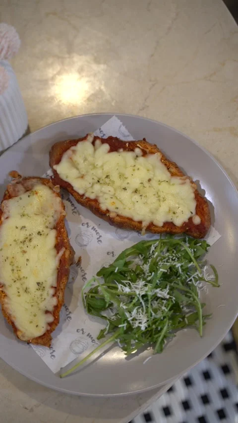 Toasted Bread with Melted Cheese and Arugula Stock Footage 336853610