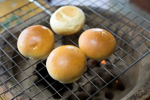 Toasted bread spread on a hot griddle. Fotos de archivo