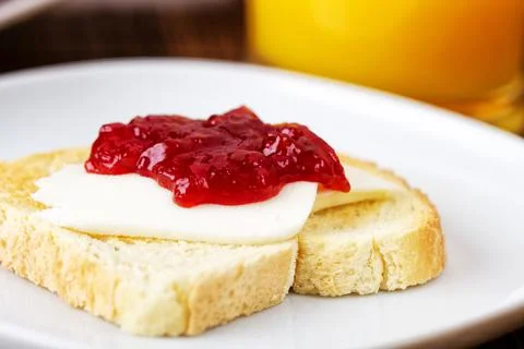 Toasted Bread with Strawberry Jam. High quality photo. Stock Photos