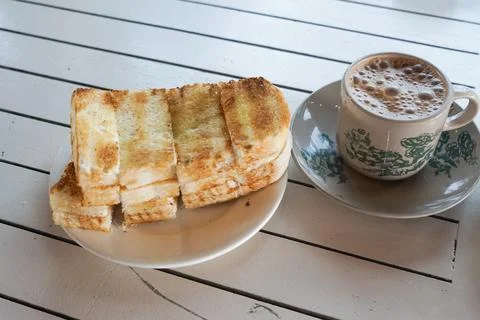Toasted Bread With Teh Tarik On Table Stock Photos