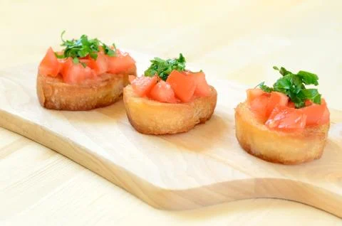 Toasted bread with tomatoes Stock Photos