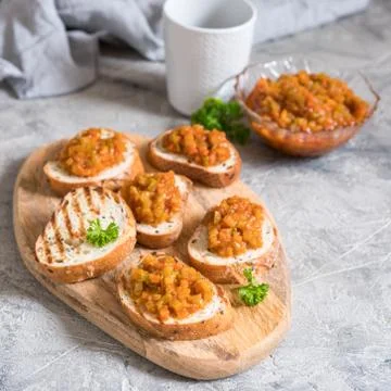Toasted bread with vegetable caviar, made of squash, pumpkin, tomato, carrot Stock Photos