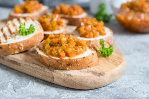 Toasted bread with vegetable caviar, made of squash, pumpkin, tomato, carrot Stock Photos