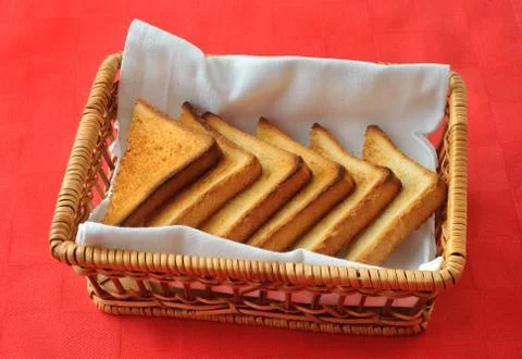 Toasted bread in the wicker basket Stock Photos