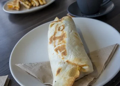 Toasted Breakfast Wrap On A Plate Stock Photos