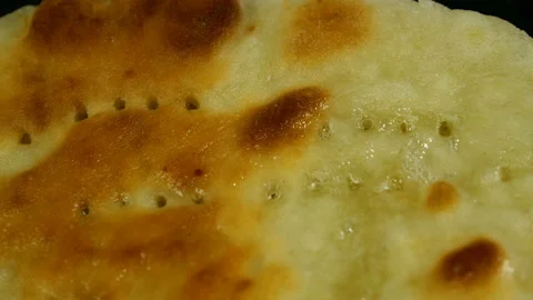 Toasted greasy flatbread is fried in cooking oil in pan. Stock Footage 131442425