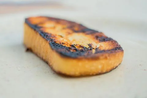 Toasted slice of white bread from the grill Stock Photos