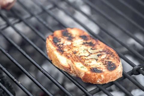 Toasted slice of white bread from the grill Stock Photos