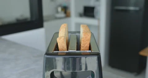Toasted slices bread pop out metal toaster in modern kitchen. Finished toasted Stock Footage 270416719