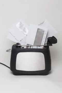 Toaster with bills Stock Photos