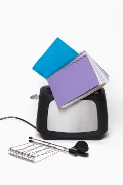 Toaster with books Stock Photos